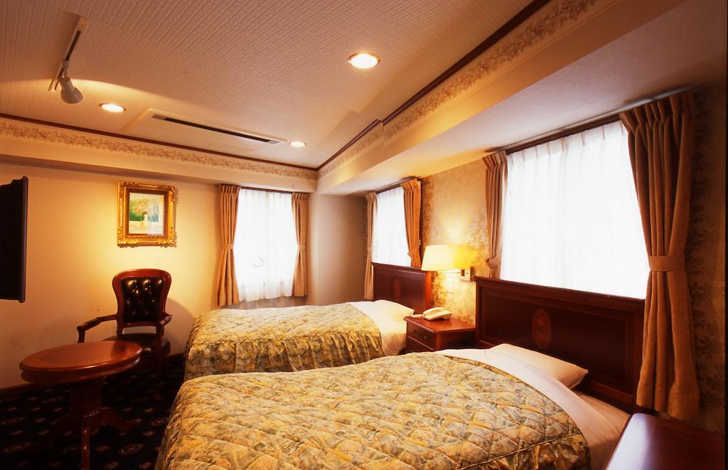 Beppu Station Hotel Habitación foto