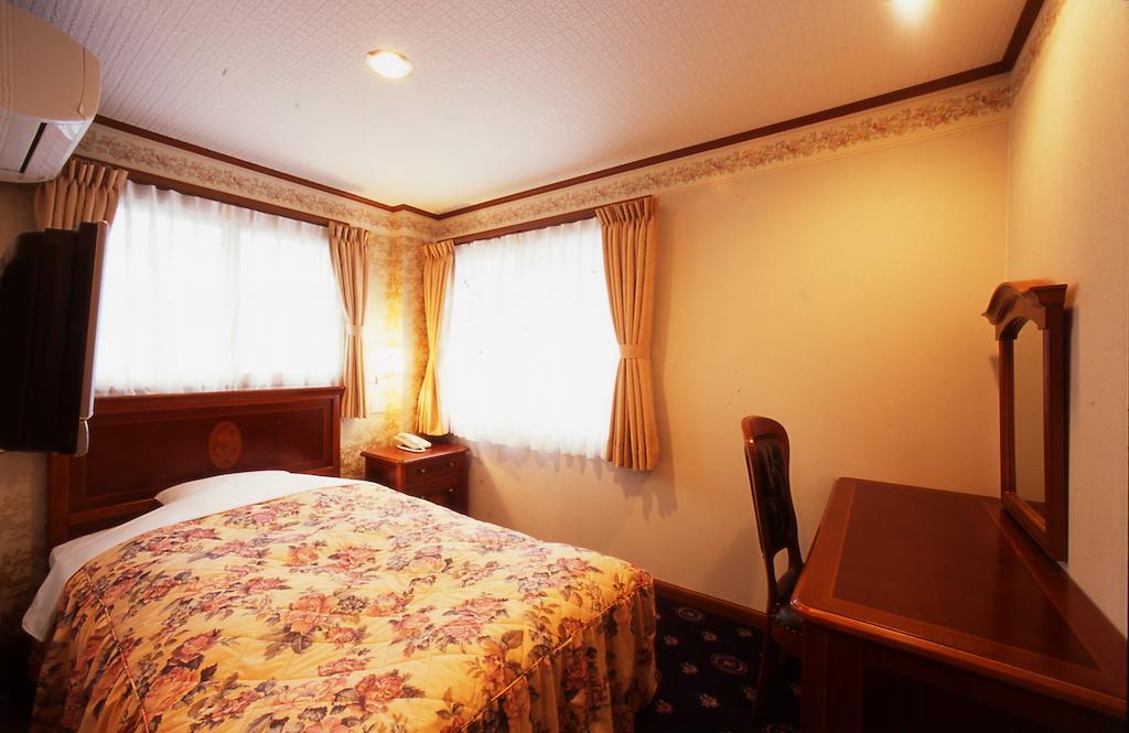 Beppu Station Hotel Habitación foto