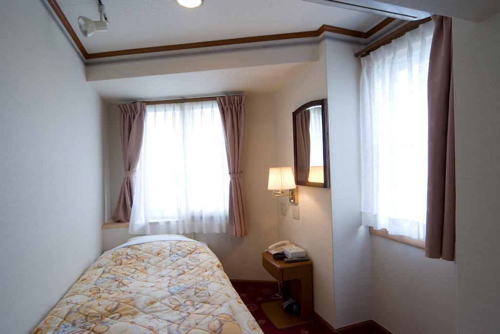 Beppu Station Hotel Habitación foto