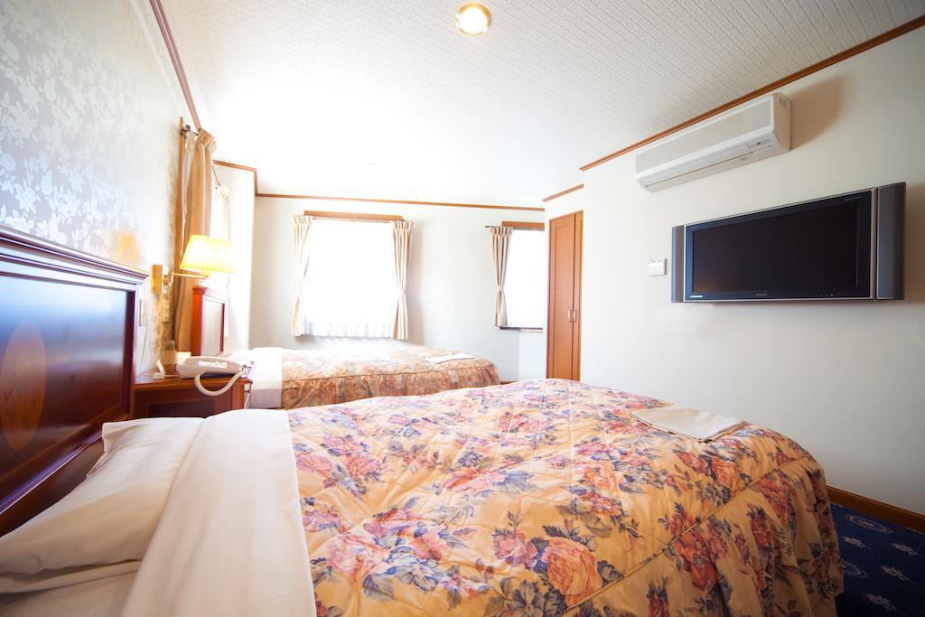 Beppu Station Hotel Habitación foto